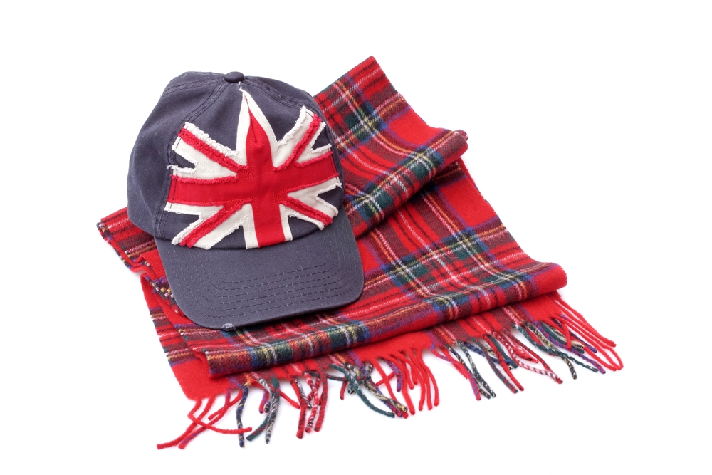Souvenirs from London. Baseball cap and tartan scarves  Isolated on white