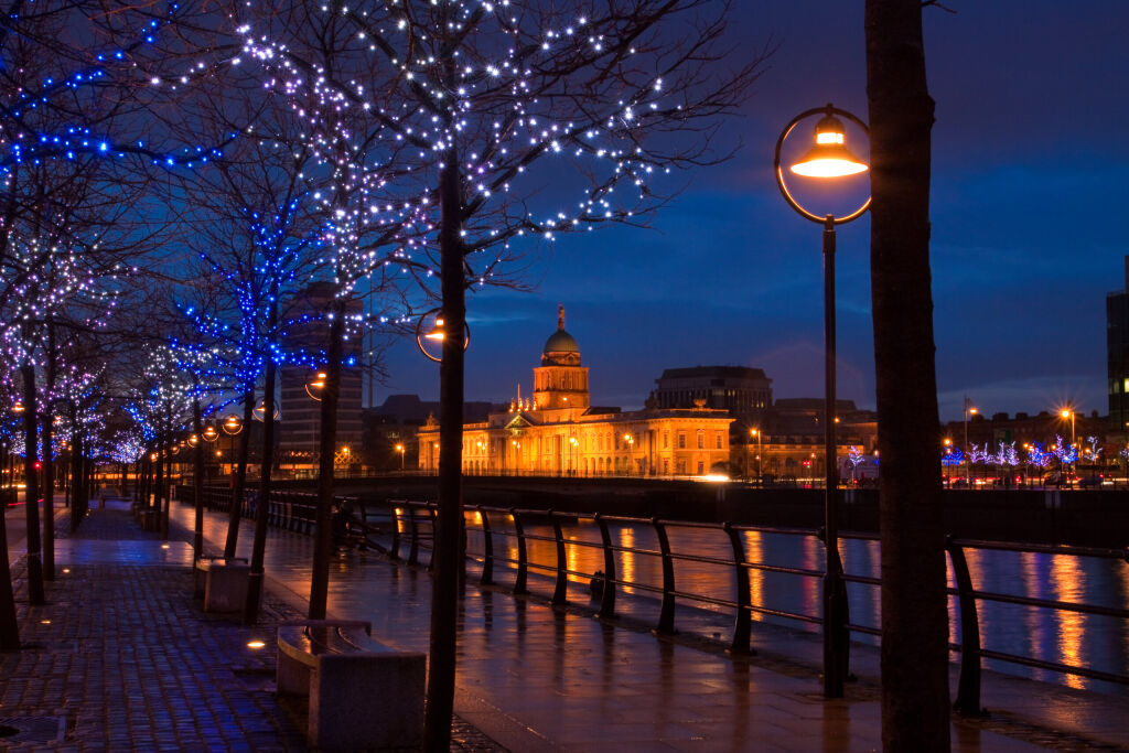 Dublin Custom House at dusk surrounded by lights