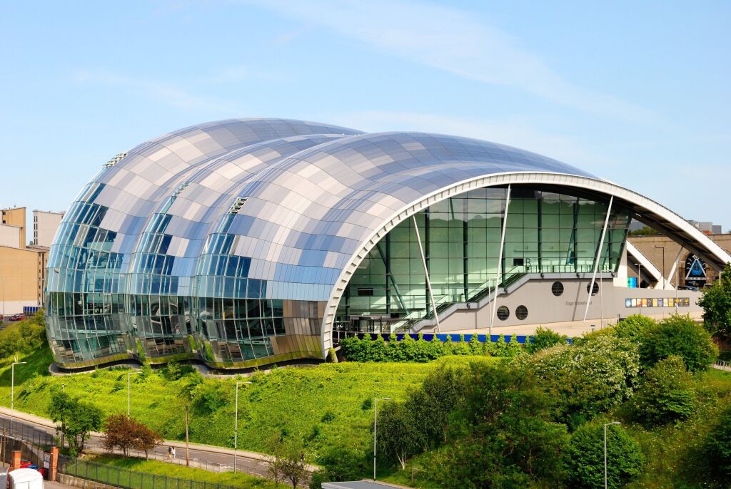 Gateshead, UK - July 3, 2019 - The curved glass and stainless steel building of the Sage Gateshead concert venue and center for musical education, located in Gateshead on the River Tyne, England