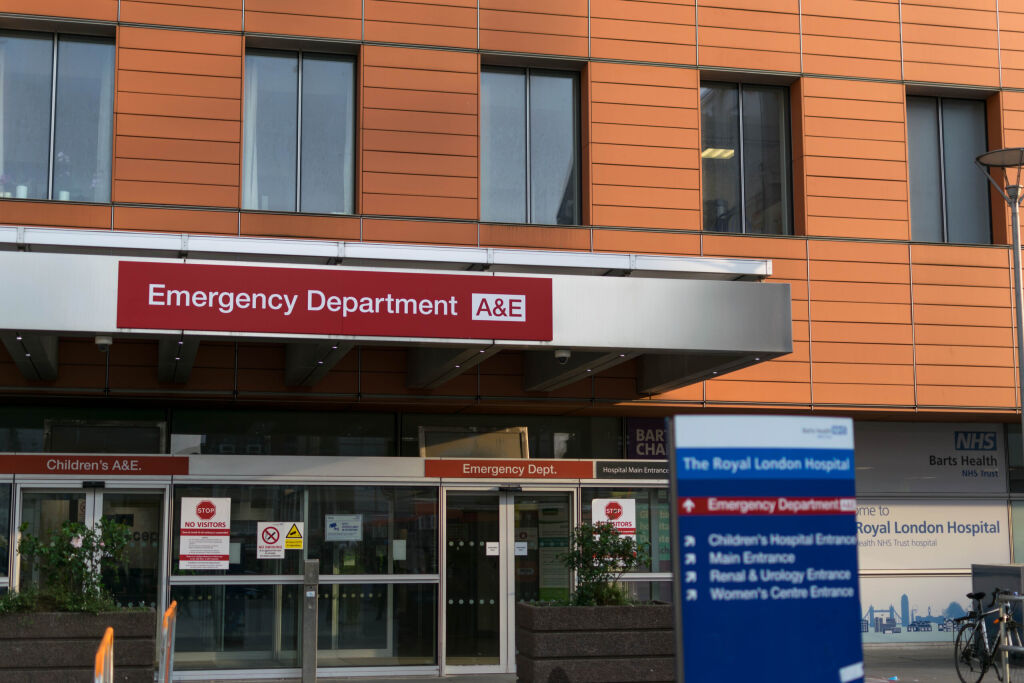 London / England - April 9th 2020: NHS Modern Royal London Hospital entrance to accident & emergency service & department. Direction signboard showing ways around the hospital. National Health Service
