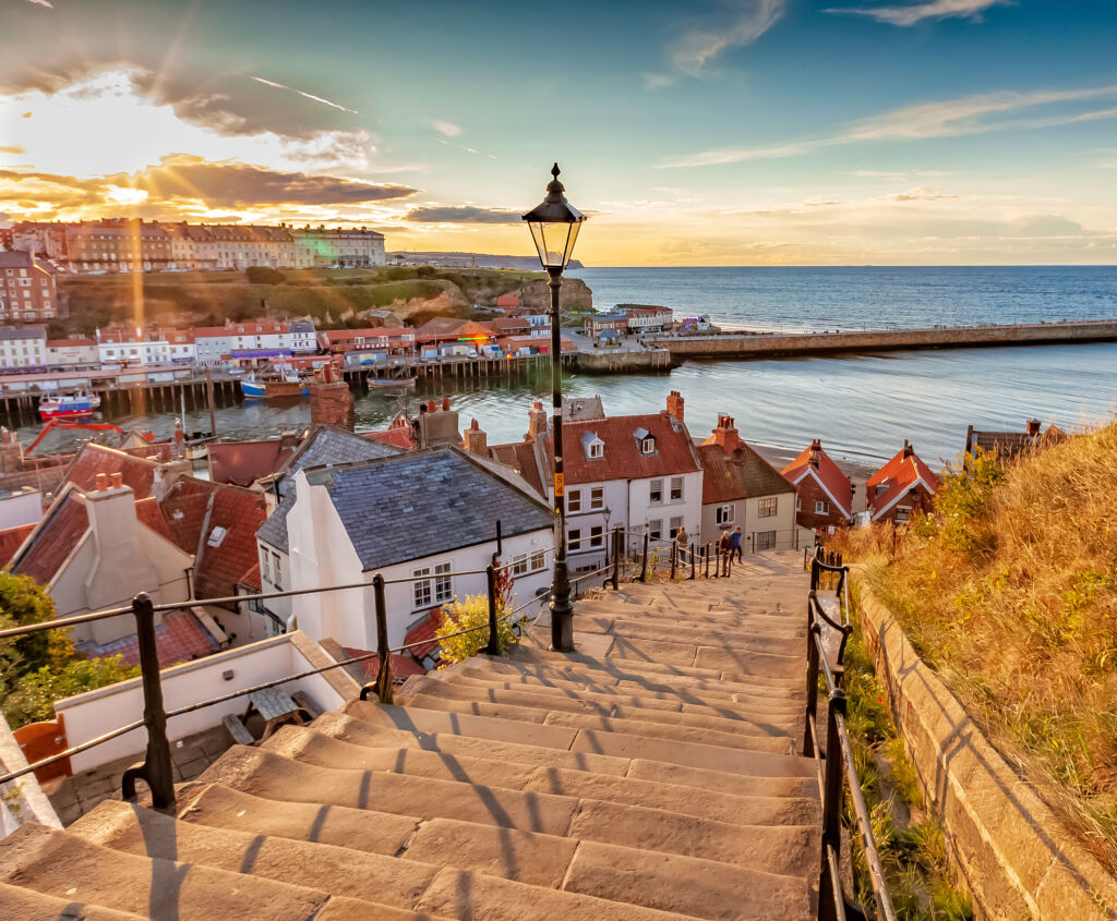 Whitby, North Yorkshire Coast, England 24th August 2018: Famous 199 steps at sunset over the harbour at Whitby