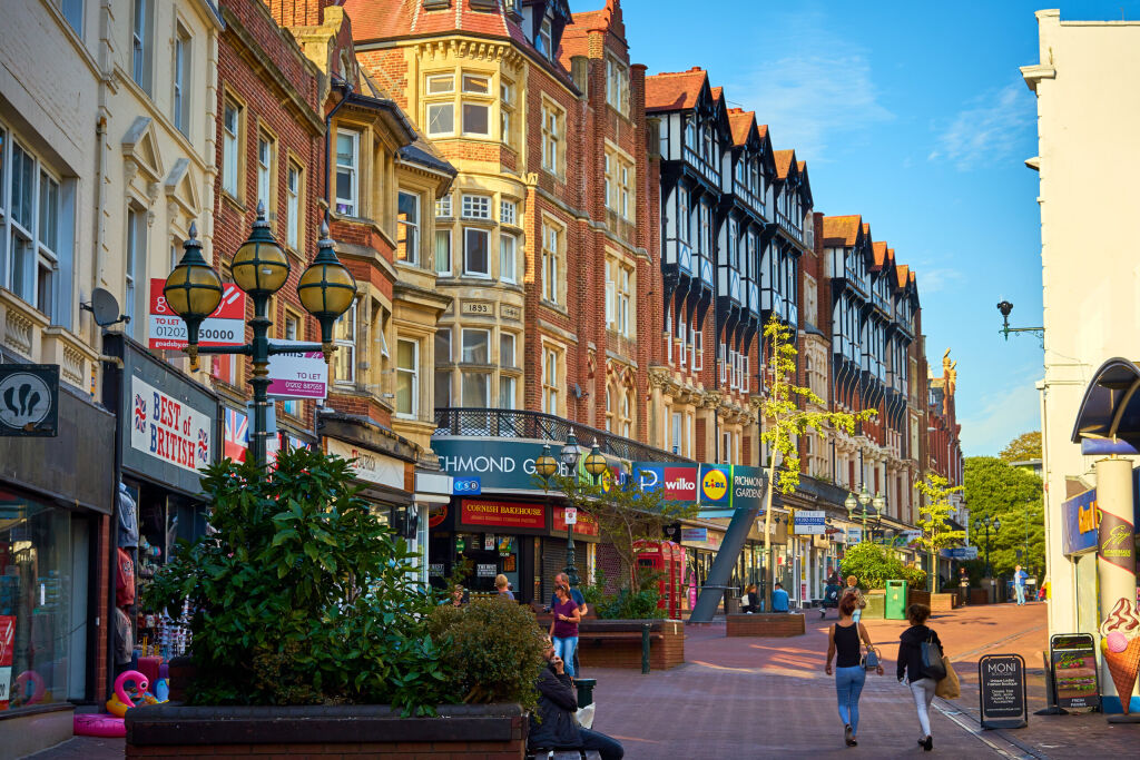 Bournemouth, Dorset / England - September 09 2018: Bournemouth high street, Christchurch Road, popular tourist shopping street with traditional historical coastal town architecture.                  